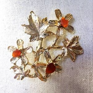 Vintage Unsigned Swoboda Goldtone Brooch Accented with Stone Chips
